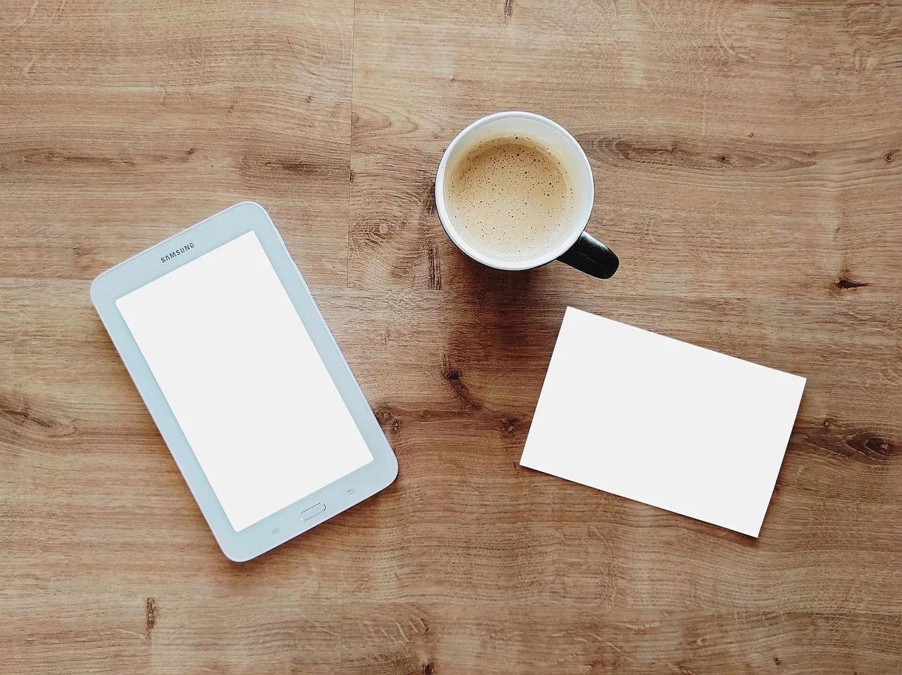 coffee, cup, tablet, card, digital tablet, mug, coffee cup, coffee mug, wooden table, flat lay. Coffee Shop POS System Comparison: Square vs Toast vs Clover