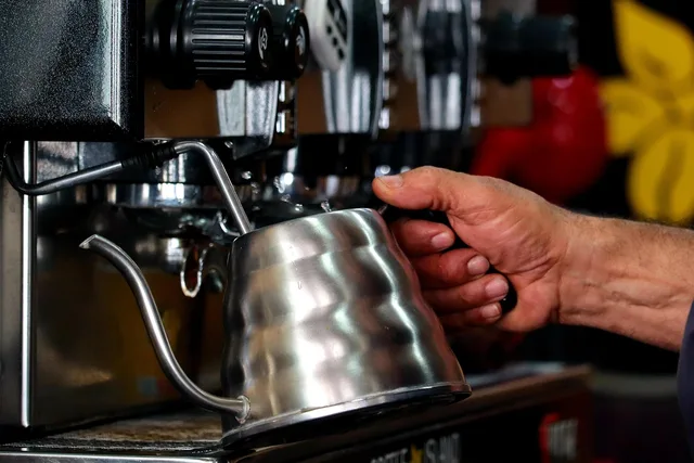 coffee machine, coffee, barista, making coffee, professional, cafe. Coffee Shop Training for New Hires: A Four-Week Plan