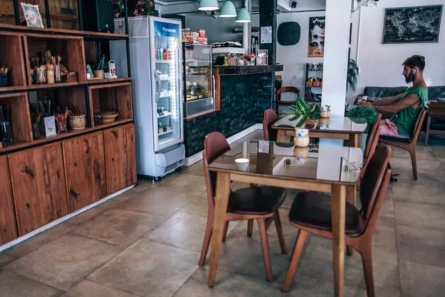 business, cafe, chairs, coffee, counter, customer, eat, food, hipster, interior, laptop, leisure, lifestyle, modern, people, relax, restaurant, retail, shop, sit, store, table, vintage, warm, wooden. Coffee Shop Local SEO Steps for Owners