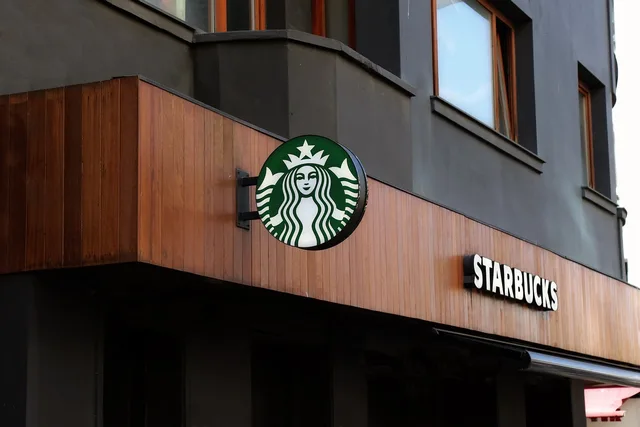 starbucks, coffee, shop, street, city, architecture, urban, advertising, building, sign, tourism, starbucks, starbucks, starbucks, starbucks, starbucks. Coffee shop site selection: a four-round method